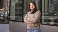 Michaela Rahimi in front of Nursing building.